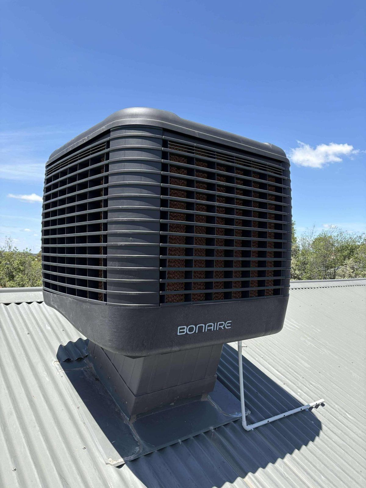 Bonaire evaporative cooler installed on a metal roof in South-East Melbourne